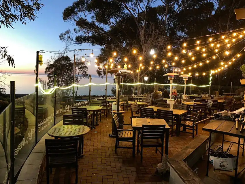 Leila by the Bay - Hercules, A Hidden Bayside Gem - Patio with people dining together.